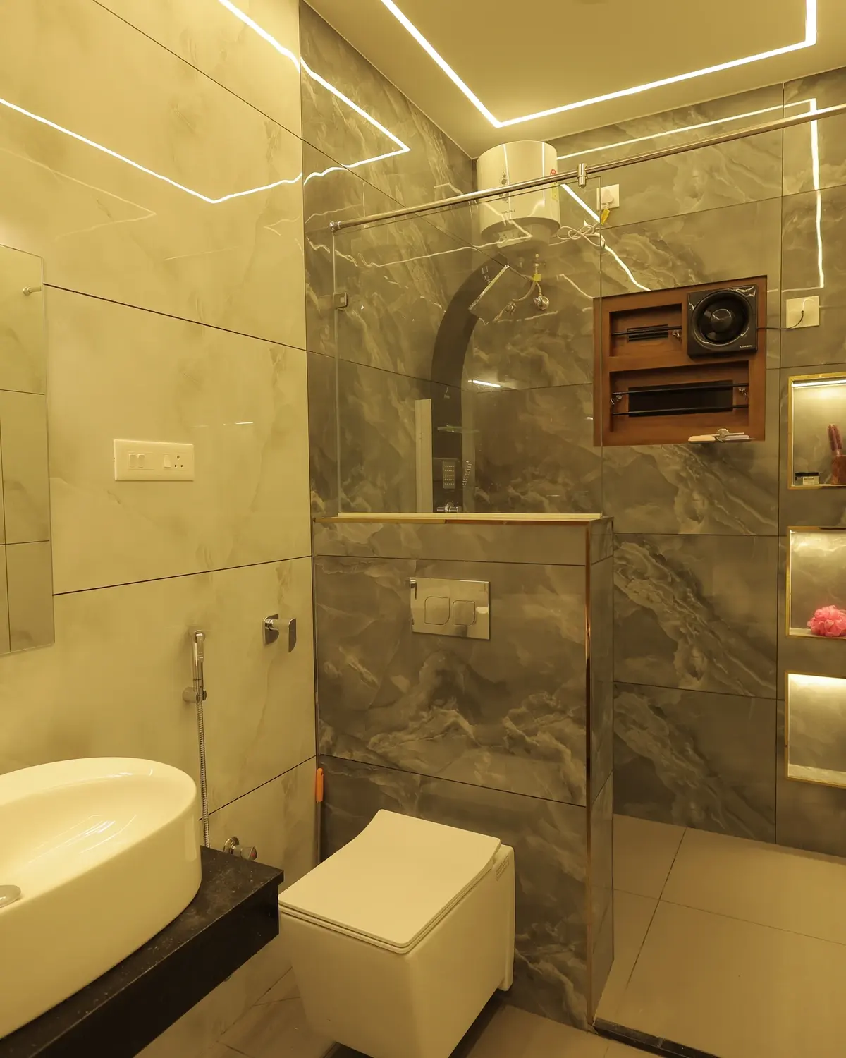 Finished luxury bathroom with vanity basin, chrome tapware, and marble tiles — Sunil Residence